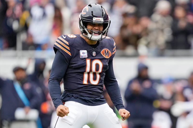 Caleb Williams #18 of the Chicago Bears celebrates after a touchdown against the New Orleans Saints in the second quarter at Soldier Field on October 19, 2025, in Chicago, Illinois.