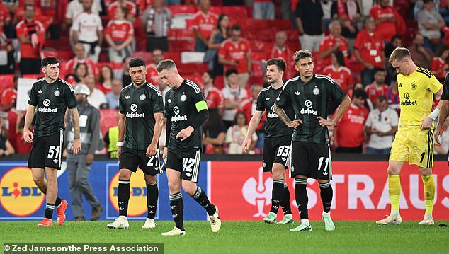Celtic players trudge off after being soundly beaten 4-1 by Benfica in Lisbon