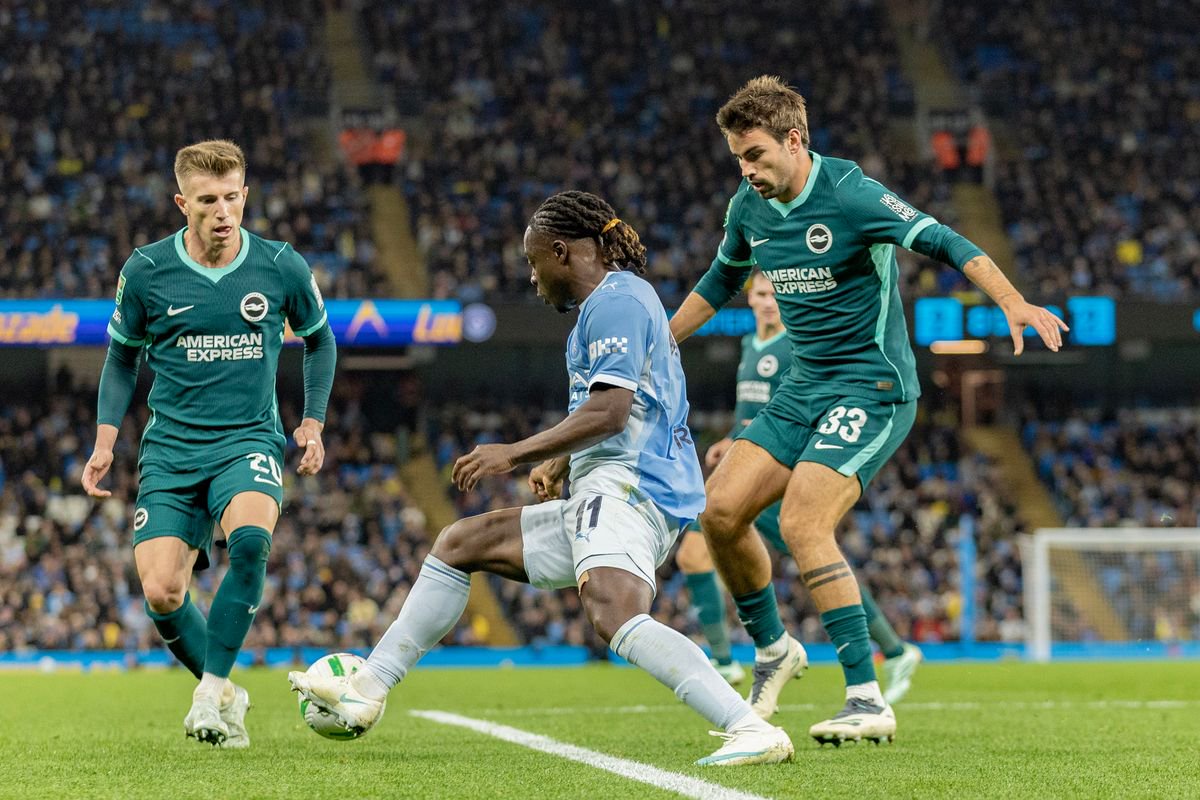Jeremy Doku #11 of Manchester City F.C. is challenged by Pascal Grob #13 of Brighton & Hove Albion F.C. during the Carabao Cup Round of 16 match between Manchester City and Brighton and Hove Albion at the Etihad Stadium in Manchester, on October 28, 2026. (Photo by Mike Morese/MI News/NurPhoto via Getty Images)