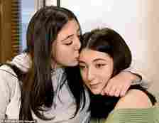 Georgian twin sisters Anna Panchulidze and Elene Deisadze embrace after being reunited