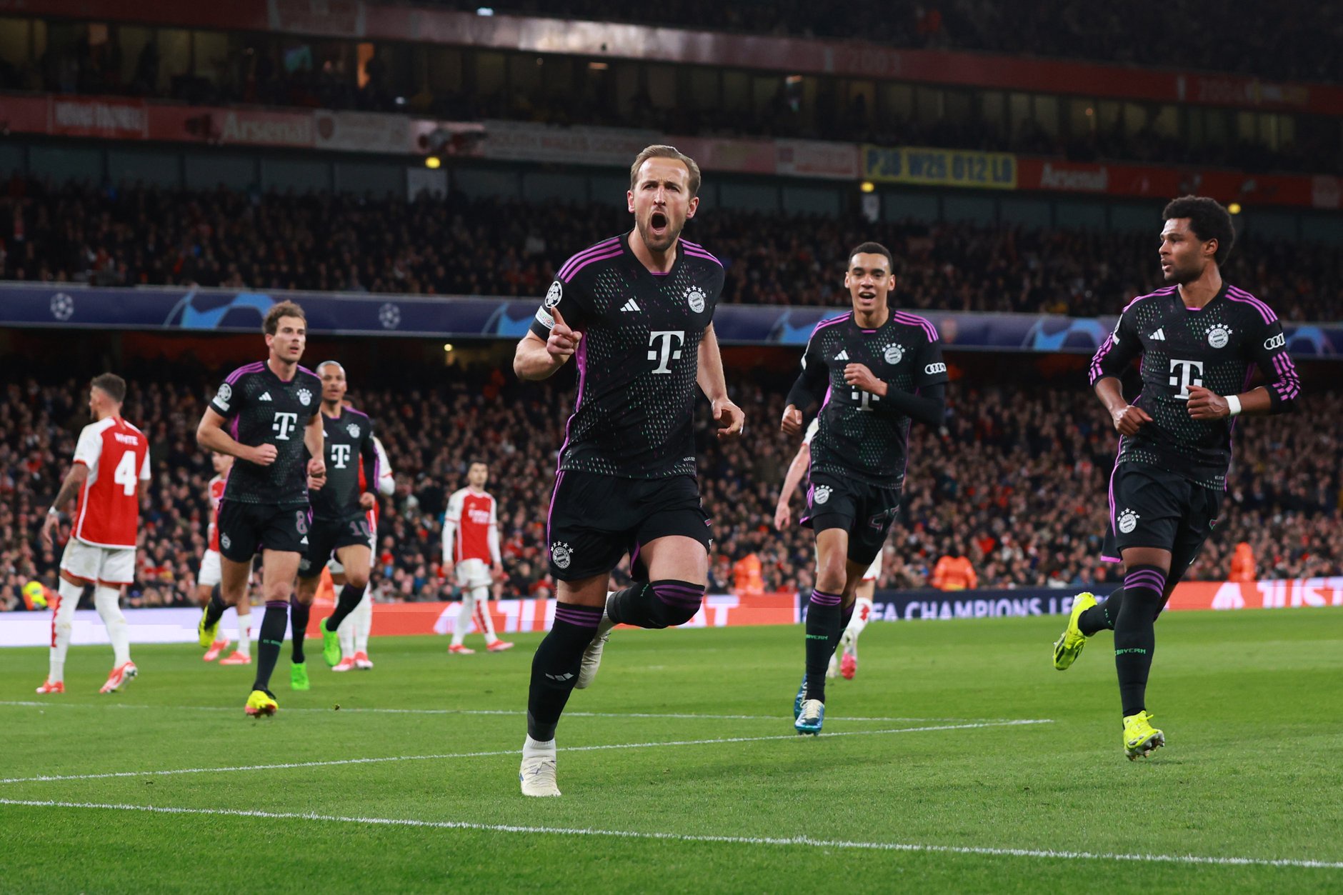 Harry Kane celebrates scoring against Arsenal