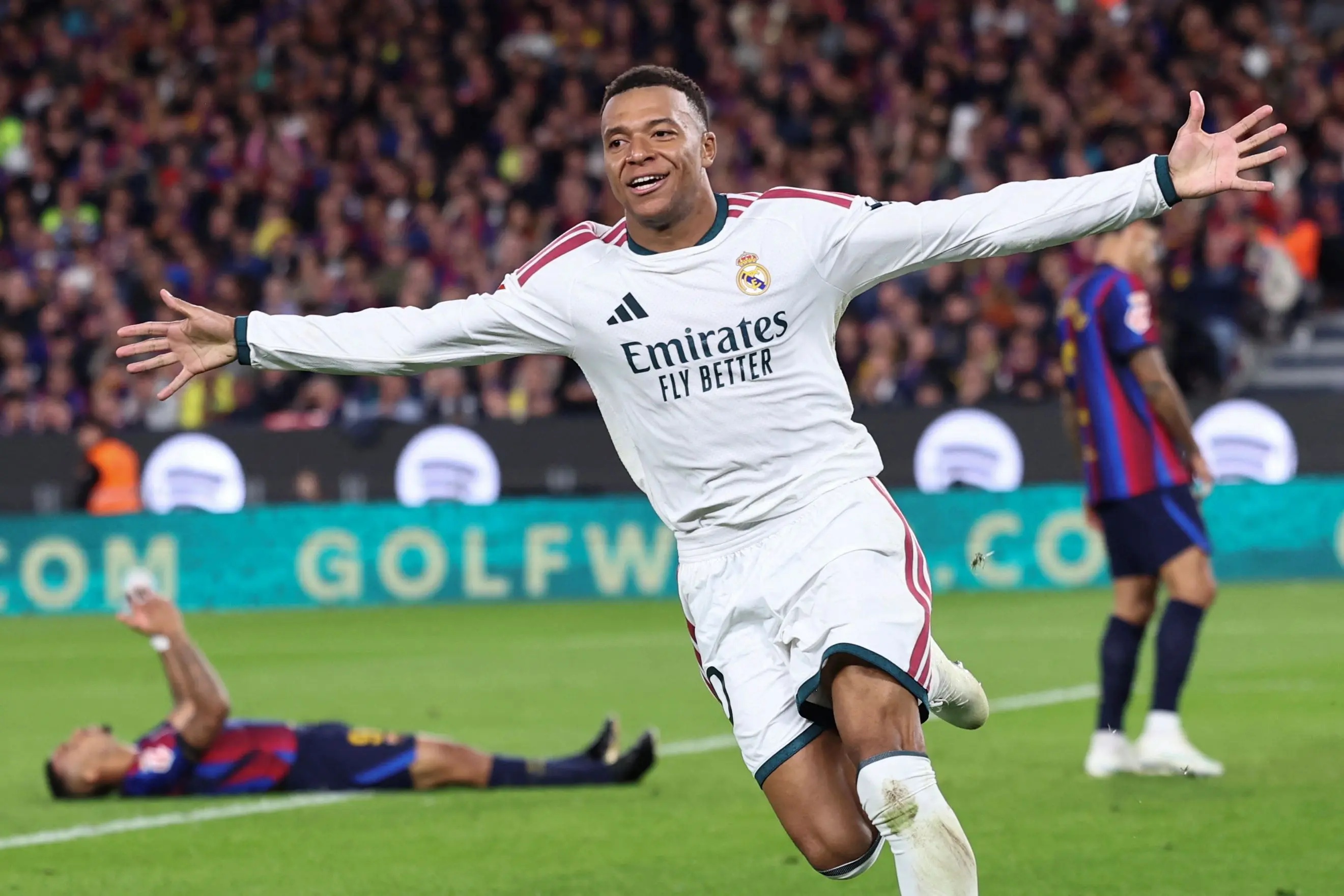 Real Madrid's French forward Kylian Mbappe celebrates scoring his team's second goal during the Spanish league football match between FC Barcelona and Real Madrid CF at Camp Nou Stadium in Barcelona
