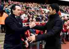 Unai Emery, Manager of Aston Villa, and Mikel Arteta, Manager of Arsenal, embrace prior to the Premier League match between Arsenal FC and Aston Vi...