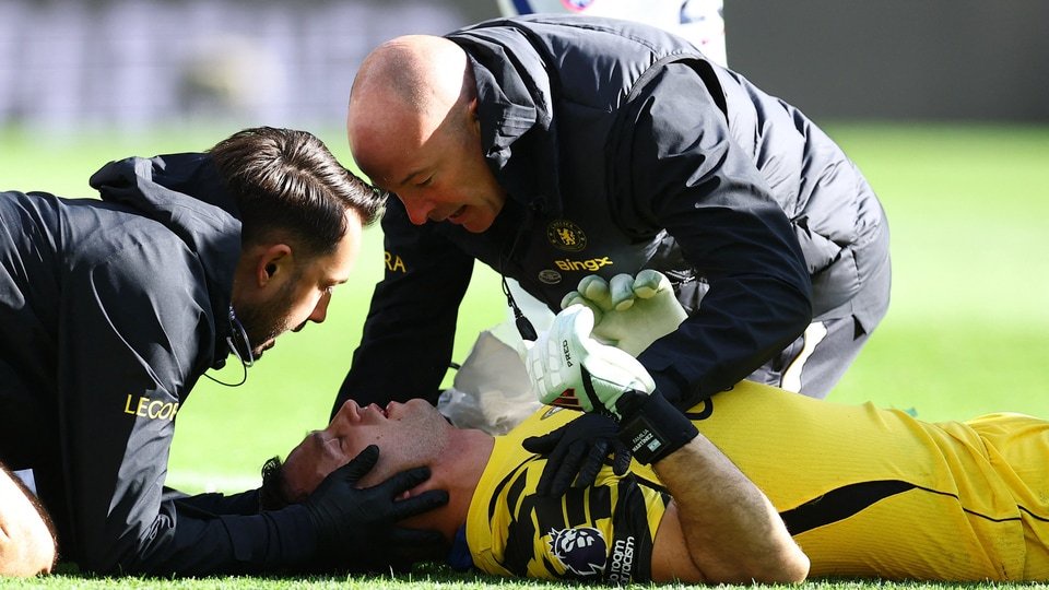 Chelsea's Emiliano Martinez receives medical attention after sustaining an injury. (REUTERS)