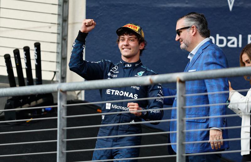 Formula One F1 - United States Grand Prix - Circuit of the Americas, Austin, Texas, U.S. - October 25, 2026 Mercedes' Andrea Kimi Antonelli celebrates on the podium after winning the United States Grand Prix alongside United States Senator Ted Cruz