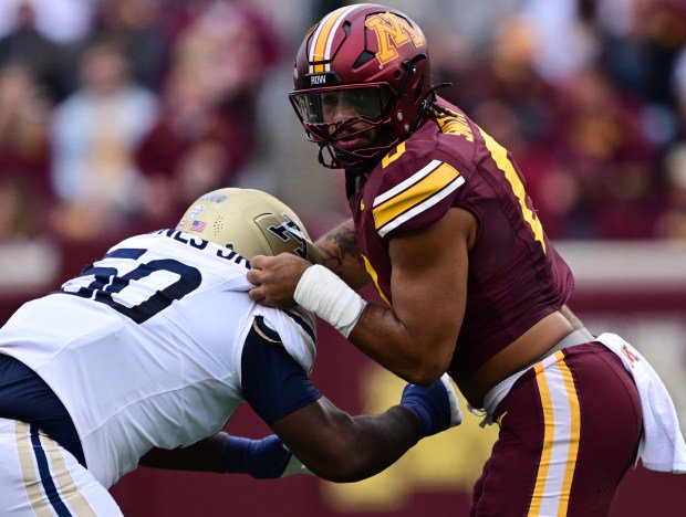 Minnesota Gophers defensive lineman Anthony Smith (0) gets past Akron Zips offensive lineman Allen Jones Jr. (50) in the first quarter of a NCAA football game at Huntington Bank Stadium in Minneapolis on Saturday, Sept. 19, 2026. (John Autey / Pioneer Press)