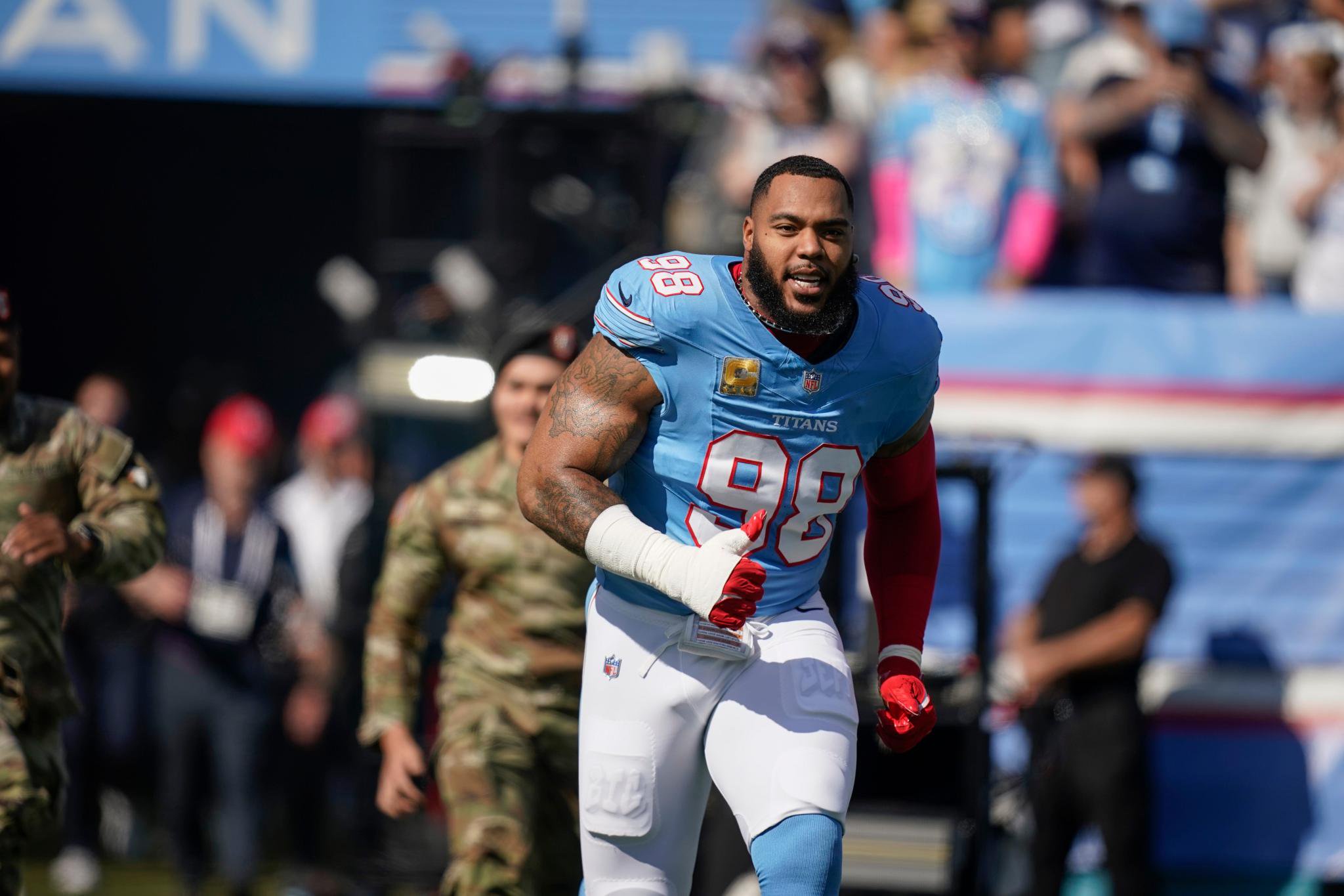 Tennessee Titans defensive tackle Jeffery Simmons (98) storms the field before a game against the Cleveland Browns in Nashville, Tenn., Sunday, October 25, 2026.
