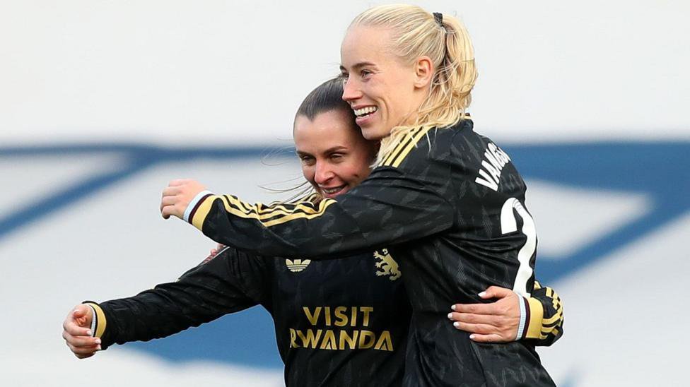 Amalie Vangsgaard hugs Noelle Maritz as both wear Aston Villa's black change kit