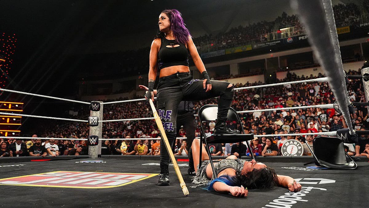 Bayley looks on over Lyra Valkyria during Monday Night RAW.