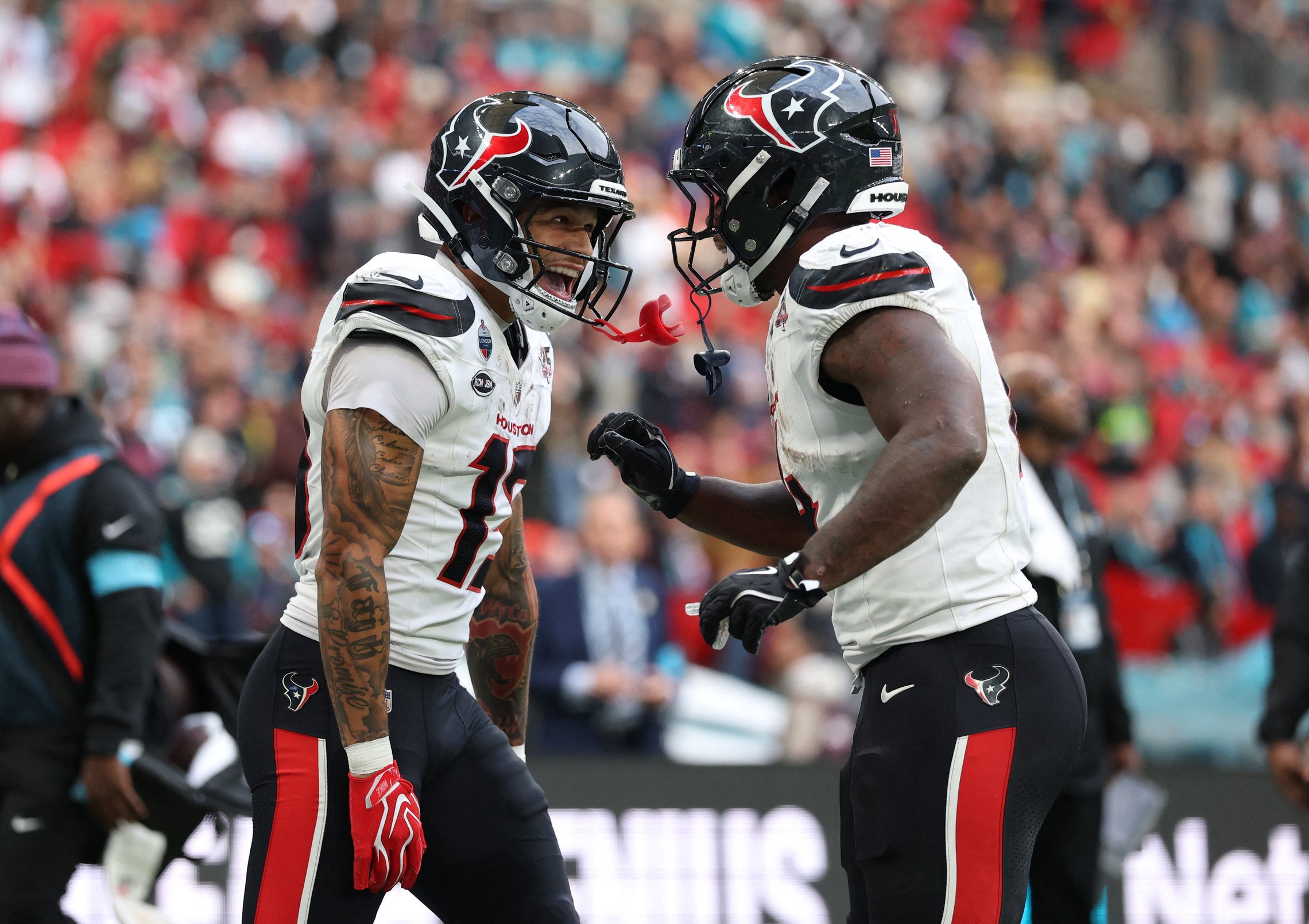 Football - NFL - Houston Texans v Jacksonville Jaguars - Wembley Stadium, London, Britain - October 18, 2026 Houston Texans' Jaylin Noel celebrates scoring their third touchdown with Woody Marks Action Images via Reuters/Paul Childs
