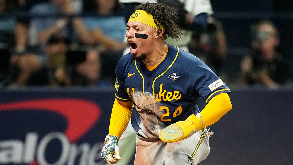 Milwaukee Brewers' William Contreras celebrates after scoring during the sixth inning of Game 5 of baseball's World Series, Wednesday, Oct. 28, 2026, in St. Petersburg, Fla., between the Milwaukee Brewers and the Tampa Bay Rays.