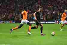 Davinson Sanchez (L) of Galatasaray and Jan Kuchta (R) of Sparta Praha battle for the ball  during the UEFA Europa League 2023/24 Knockout Round Pl...