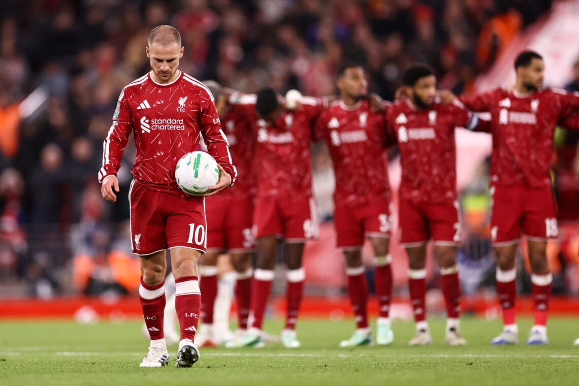 Alexis Mac Allister walks forward with the ball to take a penalty during the shootout between Liverpool and Chelsea in their Carabao Cup fourth round clash at Anfield