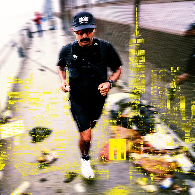 Runner in black attire jogging along a path with a blurred cityscape background and debris on the ground.