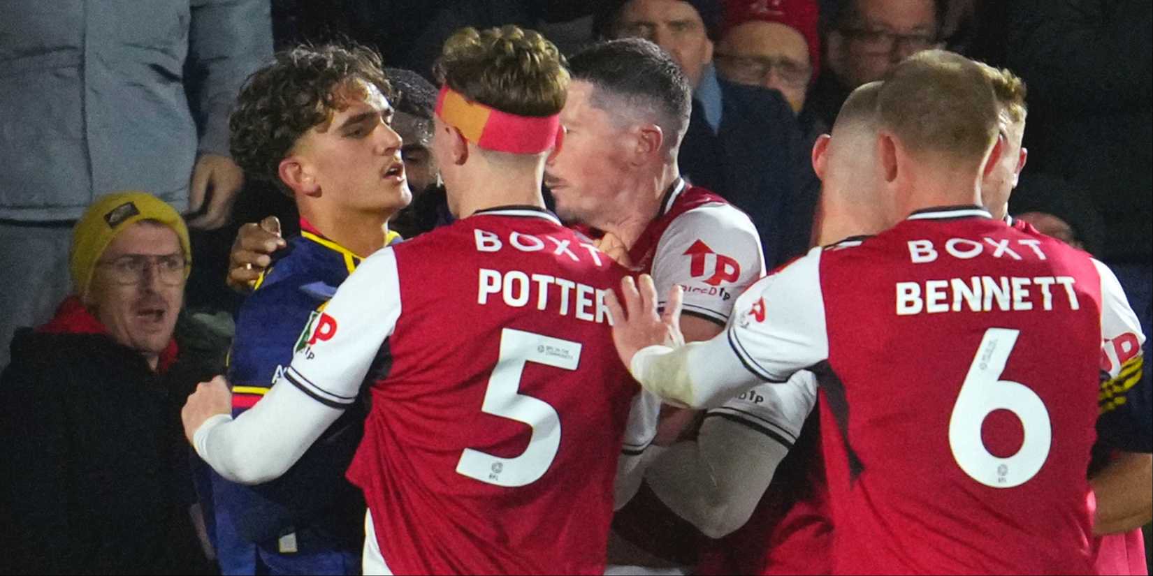 Arsenal's Max Dowman clashes with Fleetwood Town's Finley Potter and others