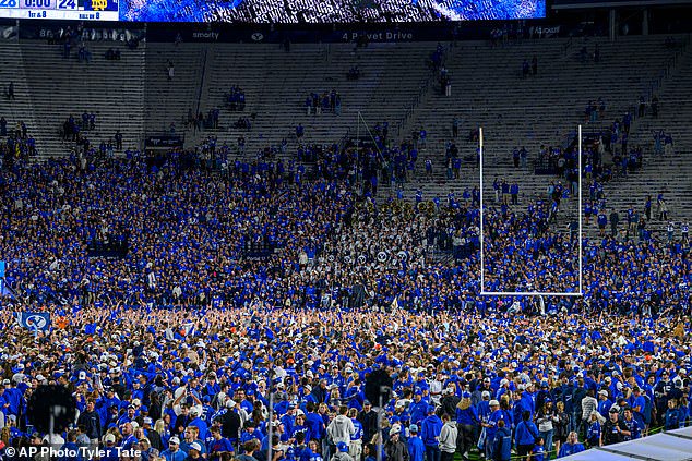 BYU fans stormed the field in Provo, Utah after an historic win over Notre Dame on Saturday