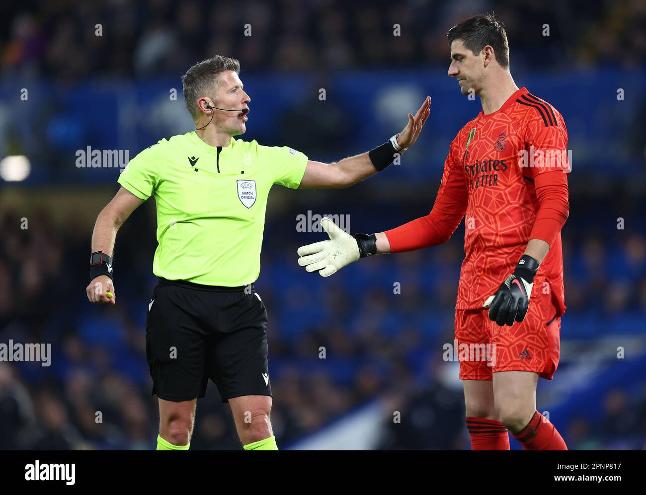 Thibaut courtois of real madrid instructed by referee daniele orsato during chelsea v real madrid football match uefa champio