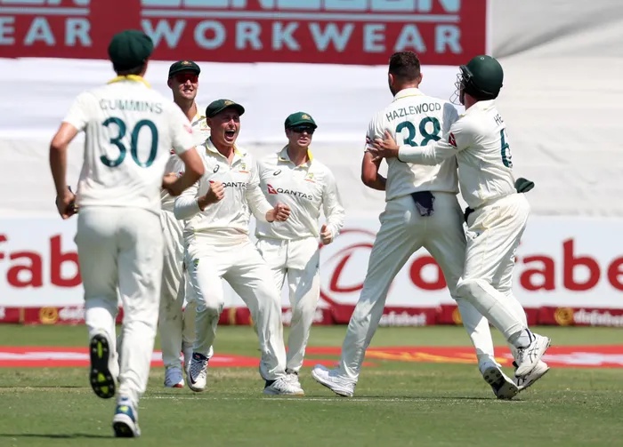 Josh Hazlewood of Australia celebrates with teammates at Kingsmead on Tuesday, where the speedster's 6/49 in SA's second innings helped set up a convincing win for the tourists.
