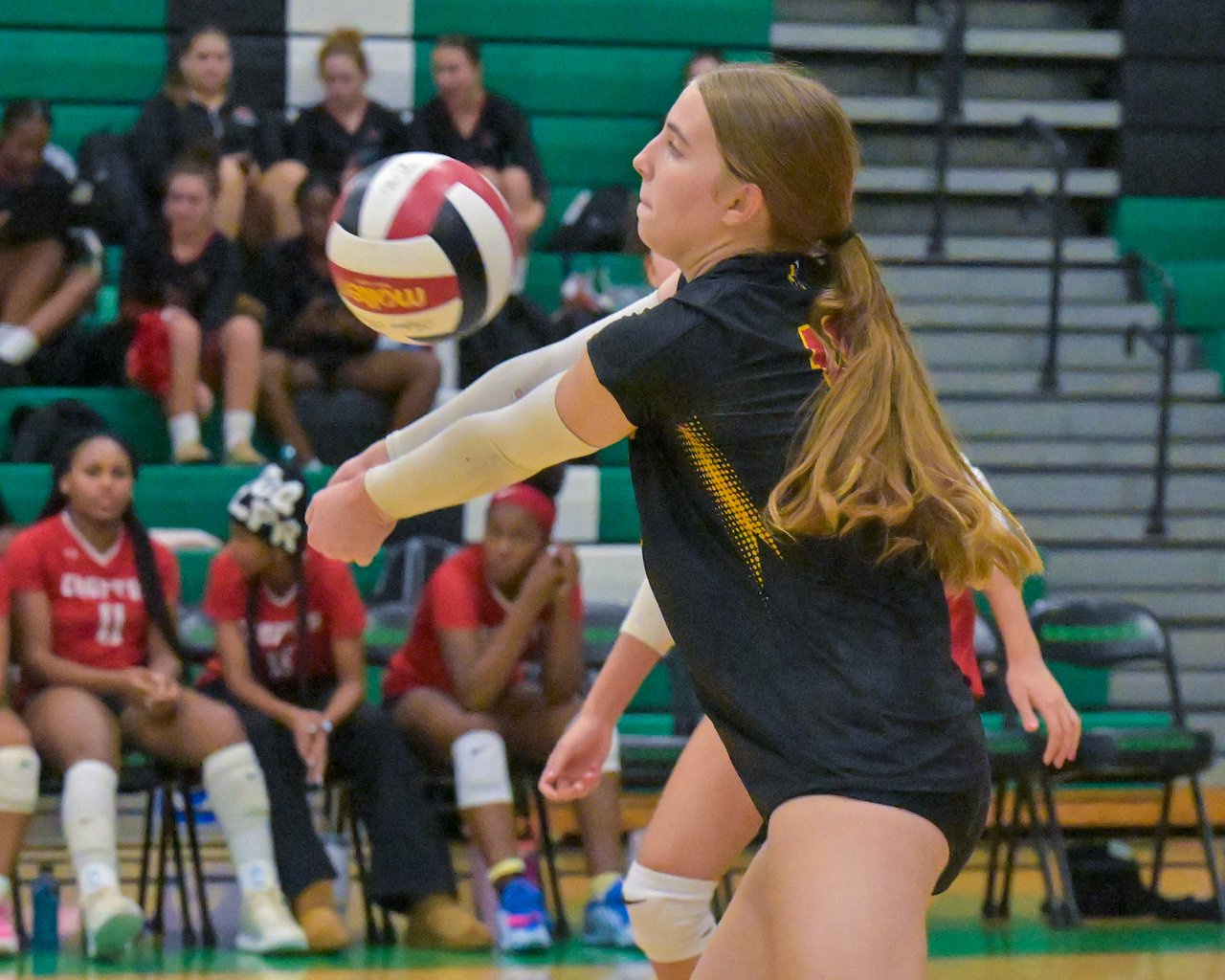 Crofton Cardinals Jemma Peterson #10 digs the ball in the first set. The Arundel Wildcats defeated the visiting Crofton Cardinals in three sets in their high school volleyball match Tuesday evening. (Paul W. Gillespie/Staff)