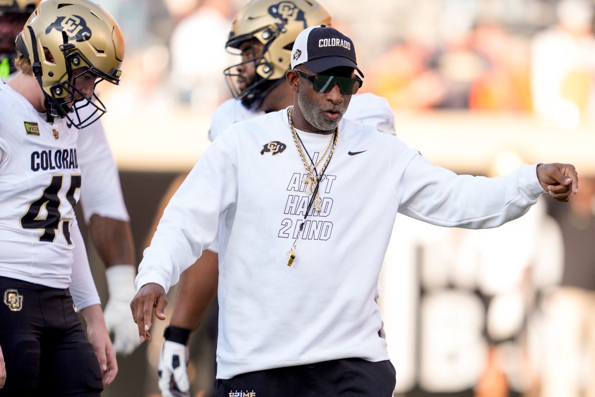 Colorado coach Deion Sanders stands on the field  as the team warms up before a college football game between the Oklahoma State Cowboys (OSU) and the Colorado Buffaloes at Boone Pickens Stadium in Stillwater, Okla., Saturday, Oct. 24, 2026.