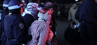 Masks are key tool against COVID-19. Should they be banned for war protesters?