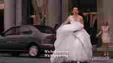Woman in a white wedding dress runs across the street while Kristen Wiig stands shocked in the background. Text reads: &quot;It&#x27;s happening. It&#x27;s happening.&quot;