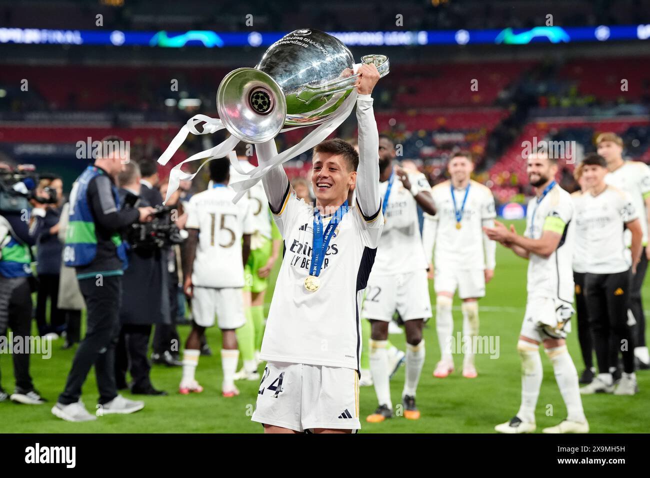 Real madrids arda guler celebrates with the trophy after winning the uefa champions league at wembley stadium in london date 