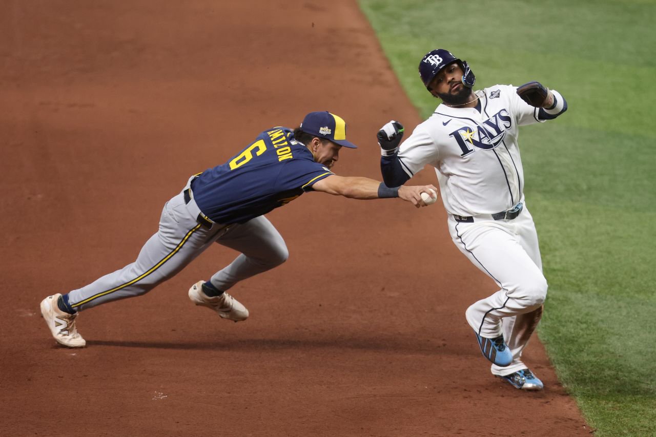 Tampa Bay's David Hamilton avoids a tag from David Hamilton in the fourth inning.