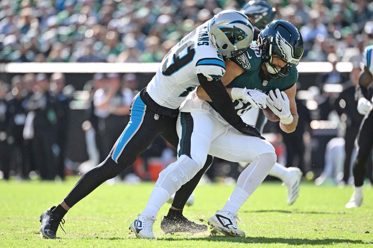 Oct 18, 2026; Philadelphia, Pennsylvania, USA; Philadelphia Eagles tight end Dallas Goedert (88) is tackled by Carolina Panthers cornerback Akayleb Evans (29) during the first half at Lincoln Financial Field. Mandatory Credit: Eric Hartline-Imagn Images