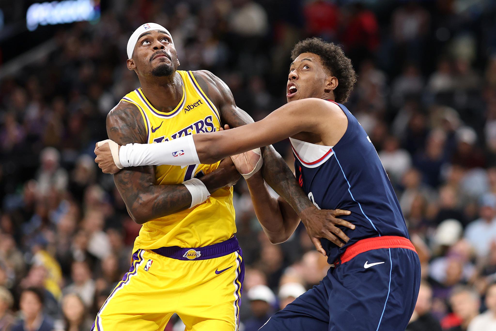 Jarred Vanderbilt of the Los Angeles Lakers battles Baba Miller of the LA Clippers for position during a game.
