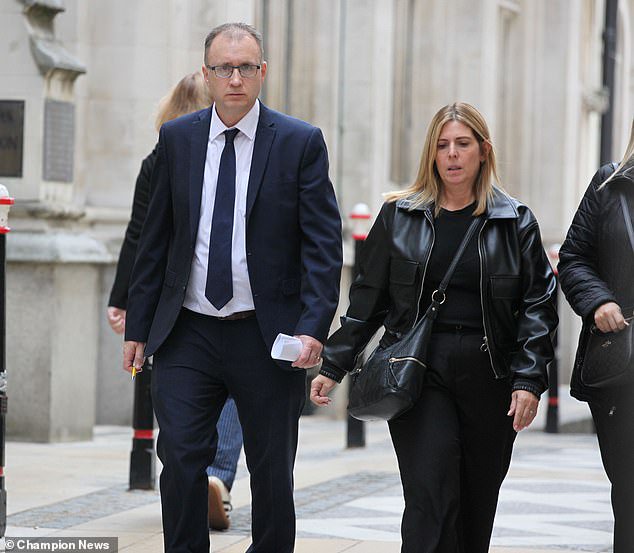 Football club president Justin Salmon and his wife Karen are pictured outside Mayor's and City County Court in London after a hearing in a dispute over a 24ft 'man cave' he built