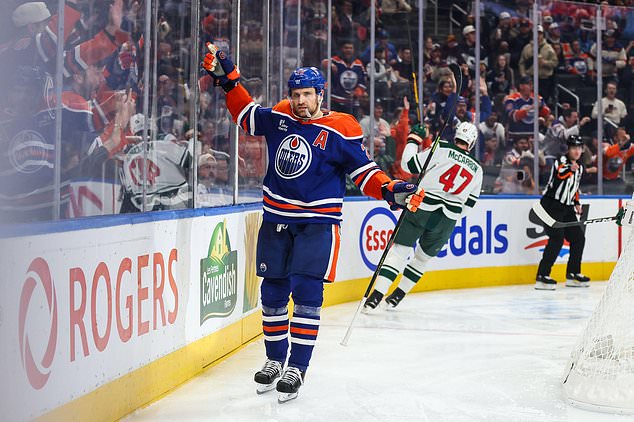 Edmonton Oilers' Leon Draisaitl (29) celebrates a goal against the Minnesota Wild during during the second period of an NHL hockey game in Edmonton, Tuesday, Oct. 20, 2026. (Codie McLachlan/The Canadian Press via AP)