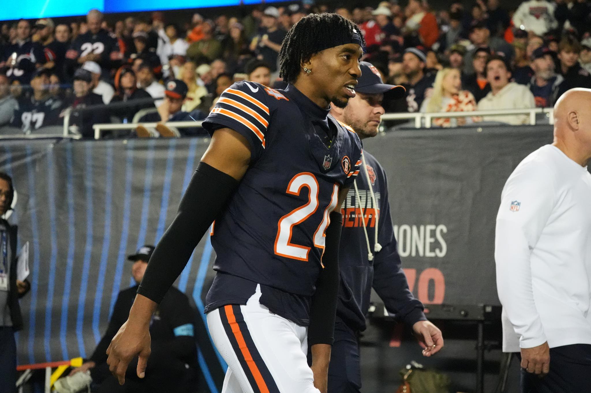 Chicago Bears cornerback Malik Muhammad walks to the locker room after suffering an injury during a game.