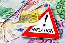 Sign and Inflation with Euro banknotes closeup