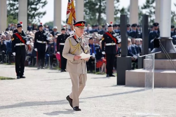 The King prepares to deliver his speech at the Royal British Legion's commemorative ceremony in Normandy today
